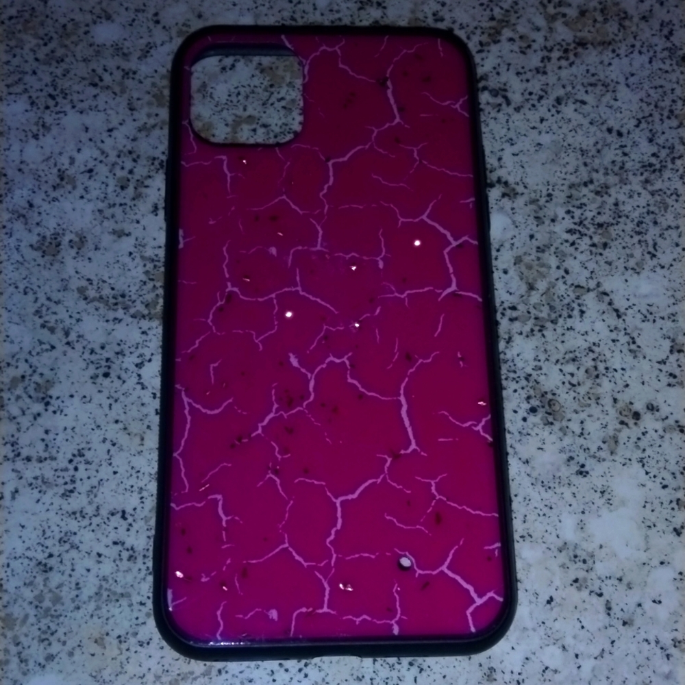 This is a pink iPhone 11 pro max phone case